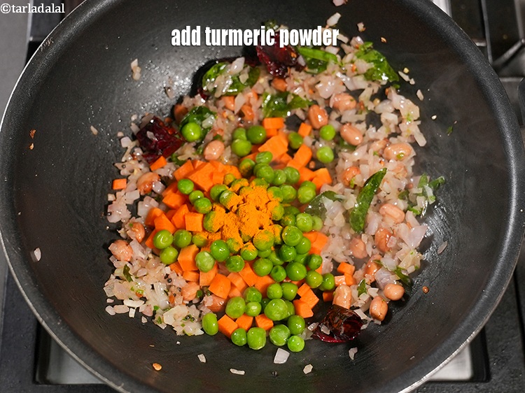 Step 27 – Add &frac12; tsp <a href="https://www.tarladalal.com/glossary-turmeric-powder-haldi-645i">turmeric powder (haldi)</a>.