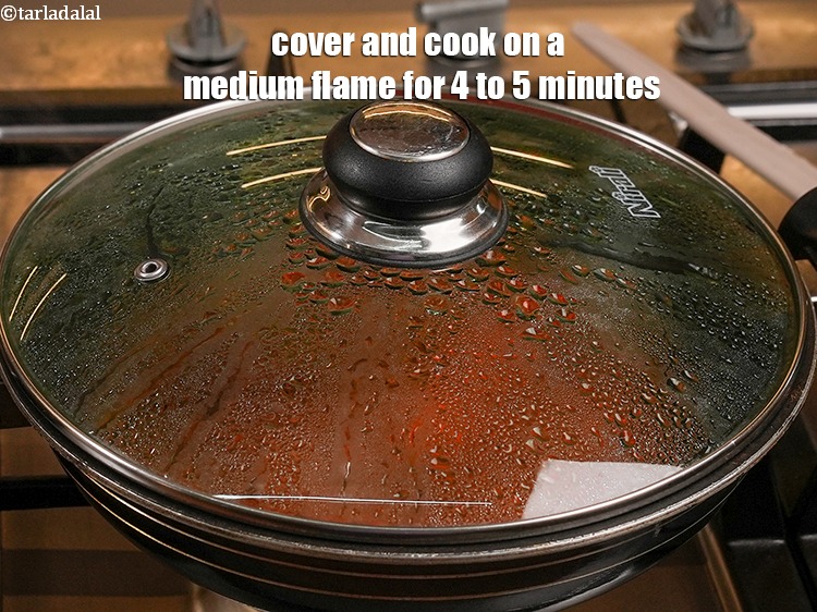 Step 27 – Cover and cook on a medium flame for 4 to 5 minutes.