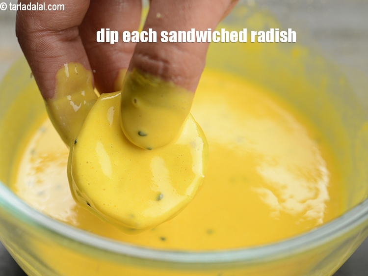 Step 28 – Dip each sandwiched radish into the prepared besan batter.