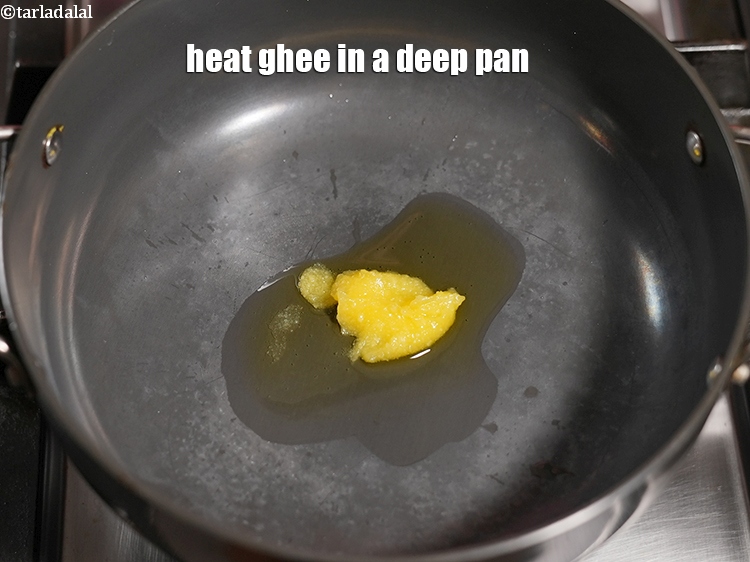 Step 27 – Heat 2 tsp <a href="https://www.tarladalal.com/glossary-ghee-245i">ghee</a>&nbsp;in a deep pan.