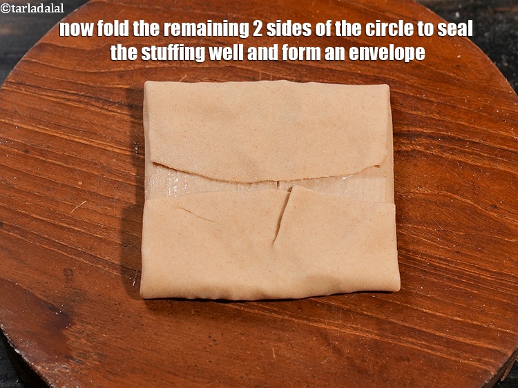 Step 27 – Now fold the remaining 2 sides of the circle to seal the stuffing well and …
