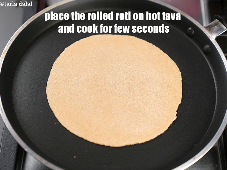 Step 29 – Place the rolled roti on hot tava and cook for few seconds.
