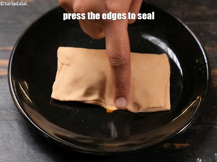Step 27 – Press the edges to seal.