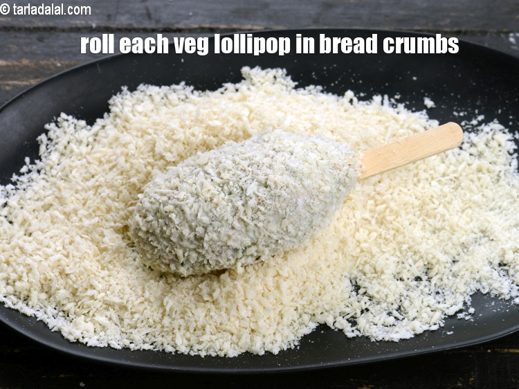 Step 28 – Roll each veg lollipop in bread crumbs.