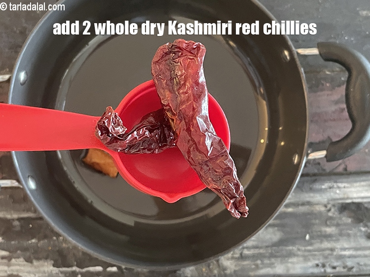 Step 28 – Add&nbsp;<meta charset="UTF-8" />2&nbsp;<a href="glossary-whole-dry-kashmiri-red-chillies-kashmiri-mirch-kashmiri-lal-mirch-332i">whole dry kashmiri red chillies</a>.