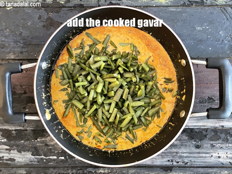 Step 32 – Add the cooked cluster beans (guvar).