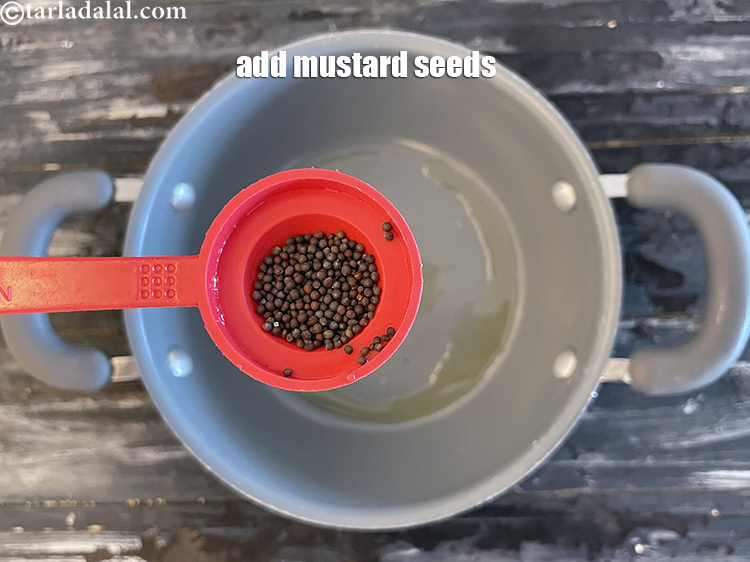 Step 35 – Add&nbsp;<meta charset="UTF-8" />1/2 tsp&nbsp;<a href="glossary-mustard-seeds-sarson-rai-sarson-ke-beej-525i">mustard seeds ( rai / sarson)</a>.