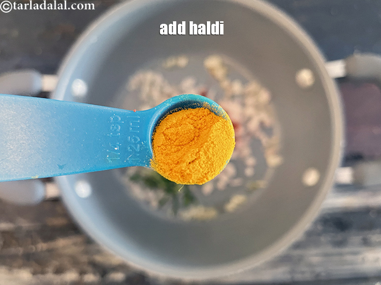 Step 27 – Add&nbsp;<meta charset="UTF-8" />a pinch of&nbsp;<a href="glossary-turmeric-powder-haldi-645i">turmeric powder (haldi)</a>. We used 1/4 tsp haldi.