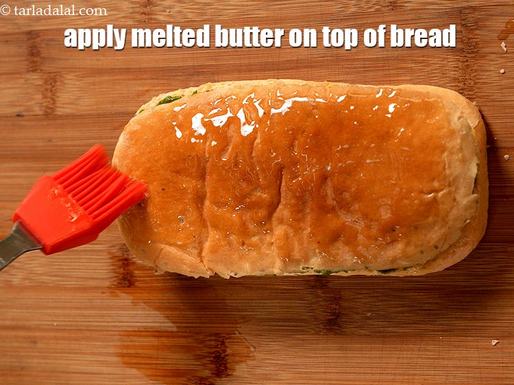 Step 31 – Apply &frac12; tsp of melted butter on top of the bread.