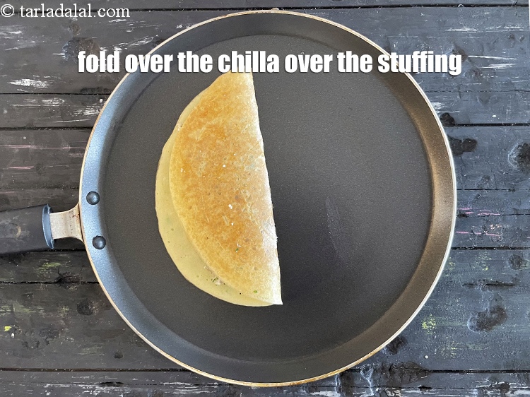 Step 36 – Fold over the chilla over the stuffing.
