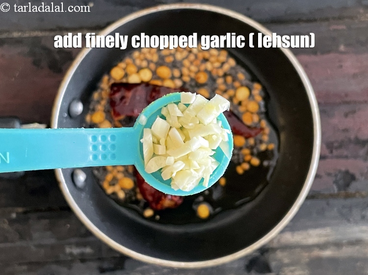 Step 27 – Add&nbsp;<meta charset="UTF-8" />1 tsp&nbsp;finely&nbsp;<a href="glossary-chopped-garlic-790i">chopped garlic (lehsun)</a>.