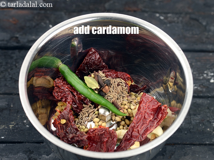 Step 28 – Add 1 <a href="https://www.tarladalal.com/glossary-cardamom-elaichi-262i">cardamom (elaichi)</a>.