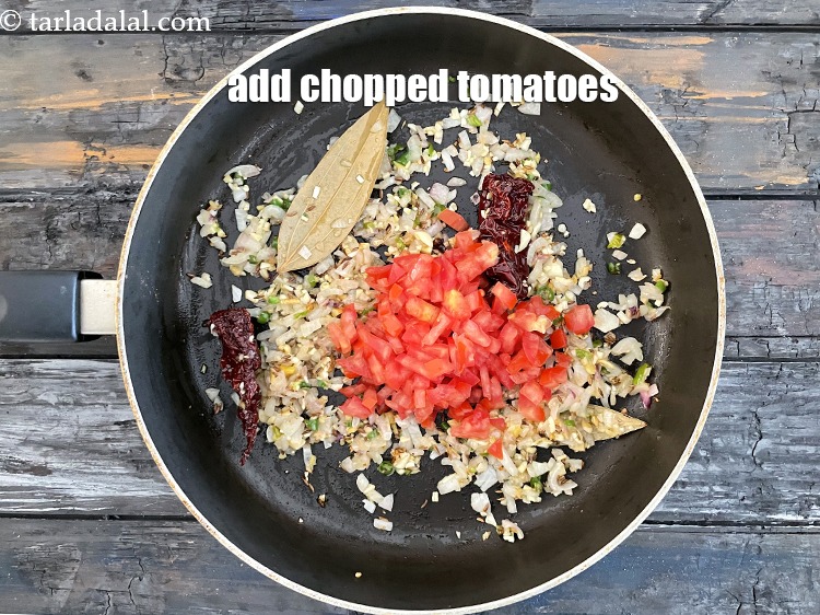 Step 27 – Add&nbsp;<meta charset="UTF-8" />1/2 cup&nbsp;<a href="glossary-chopped-tomatoes-779i">chopped tomatoes</a>.