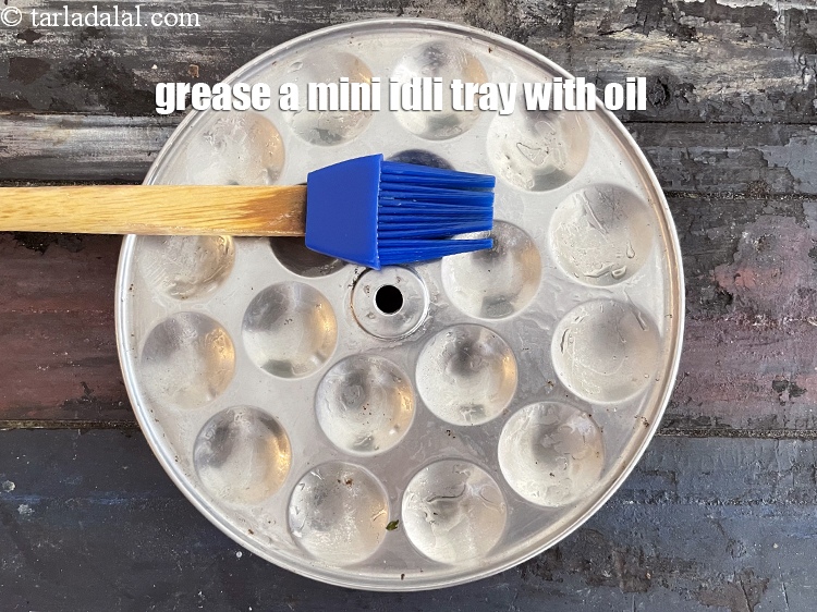 Step 28 – Grease the mini idli tray with oil.