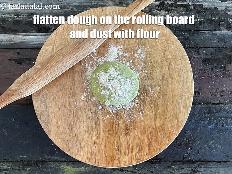 Step 29 – Flatten the dough&nbsp;on the rolling board and dust with flour.