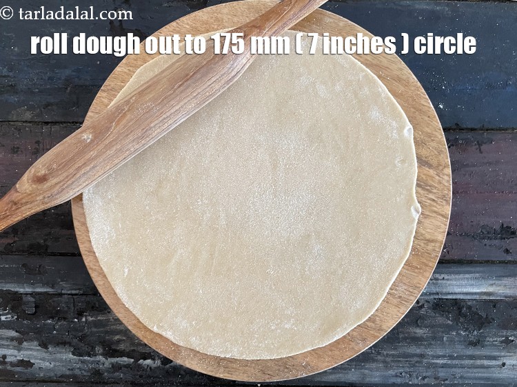 Step 29 – Roll out a portion of the dough into a 175 mm. (7&rdquo;) diameter circle using …