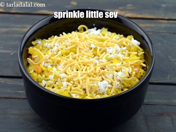 Step 27 – Sprinkle 2 tbsp <a href="https://www.tarladalal.com/glossary-sev-1137i">sev</a>.&nbsp;