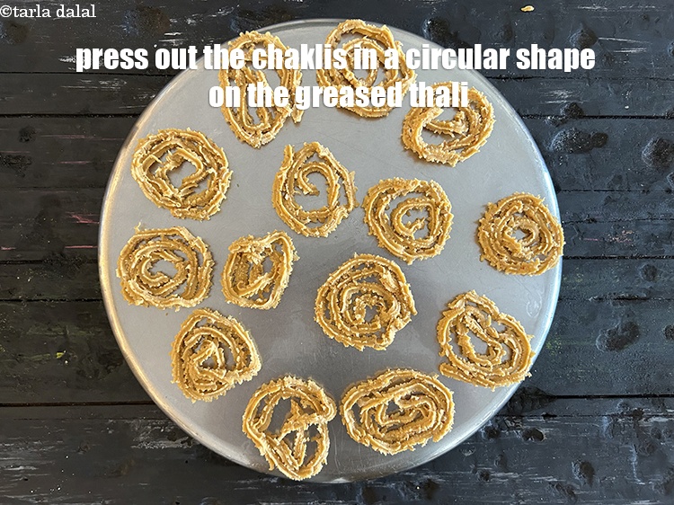 Step 28 – To make <strong>soya chaklis</strong>, follw steps above of putting the dough in the chakli press. …