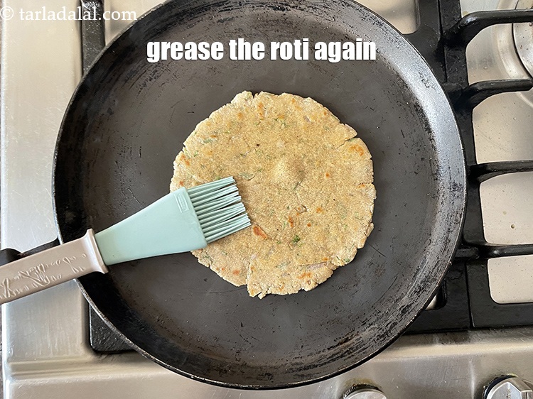 Step 27 – Grease the roti again and flip and cook till golden brown.