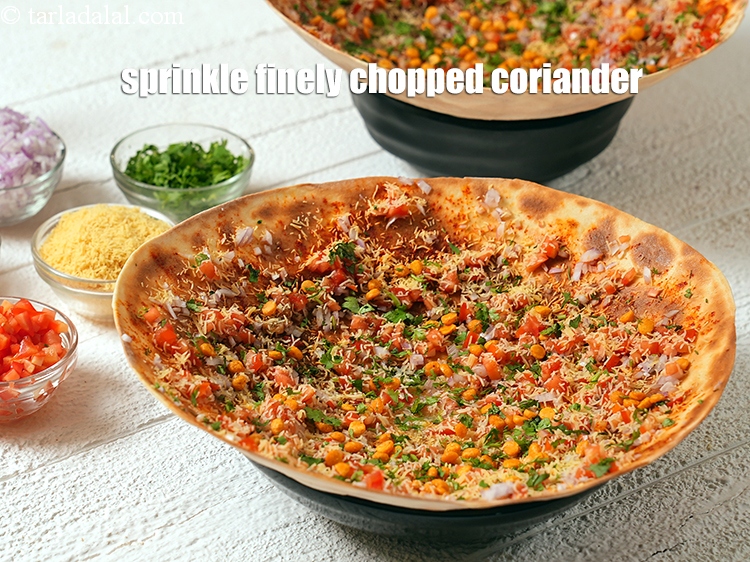 Step 28 – Sprinkle 1 tbsp finely <a href="https://www.tarladalal.com/glossary-chopped-coriander-783i">chopped coriander (dhania)</a>.