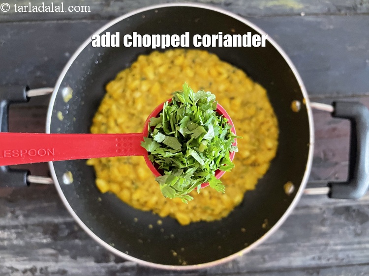 Step 34 – Add&nbsp;<meta charset="UTF-8" />2 tbsp&nbsp;finely&nbsp;<a href="glossary-chopped-coriander-783i">chopped coriander (dhania)</a>.