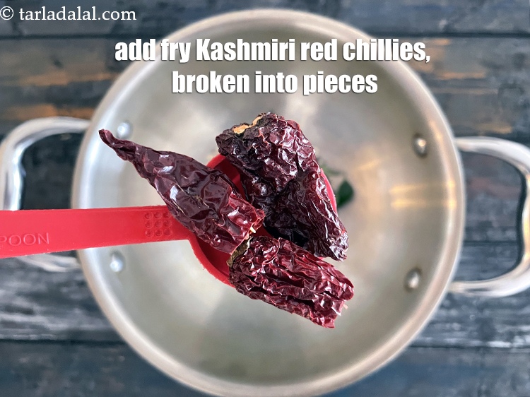 Step 27 – Add&nbsp;<meta charset="UTF-8" />2&nbsp;<a href="glossary-whole-dry-kashmiri-red-chillies-kashmiri-mirch-kashmiri-lal-mirch-332i">whole dry kashmiri red chillies</a>&nbsp;, broken into pieces.