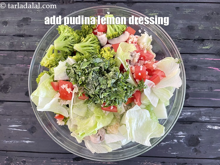 Step 28 – Add the&nbsp;pudina lemon dressing. See above for recipe on making dressing.