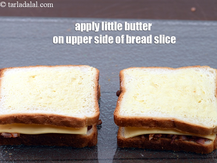 Step 27 – Apply a little butter on the upper side of the bread slice.