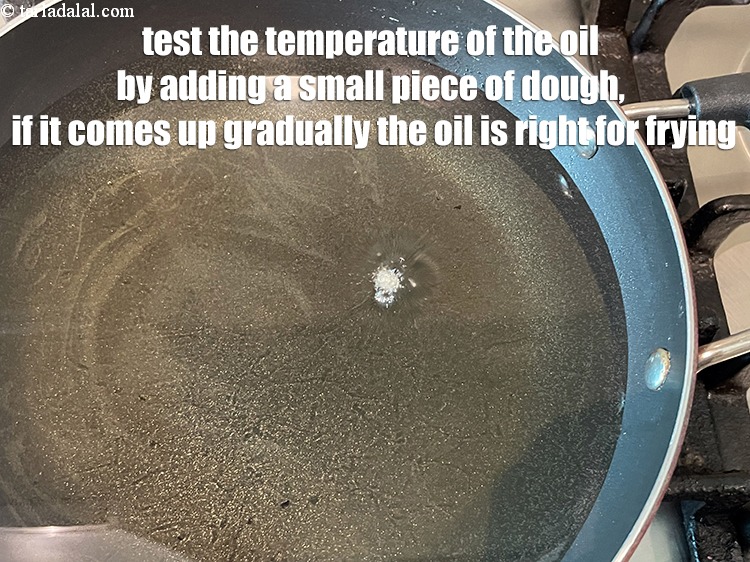 Step 41 – It would be wise to test the temperature of the oil. Add a little piece …
