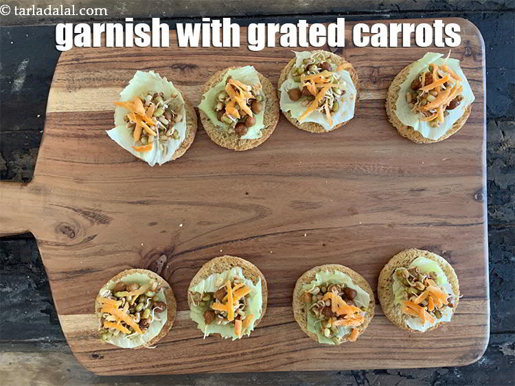 Step 26 – Add 1/2&nbsp;tbsp of carrots evenly over each toasted roundel.