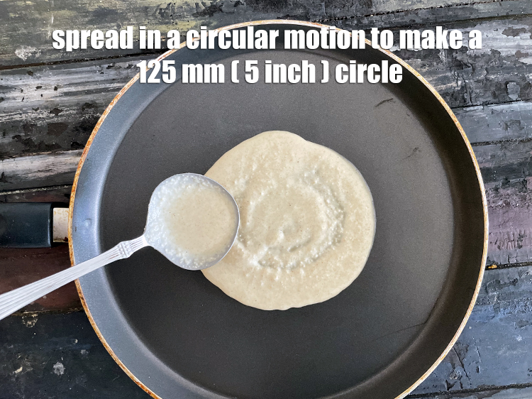 Step 31 – Spread in a circular motion to make a 125 mm. (5") thick uttapam.