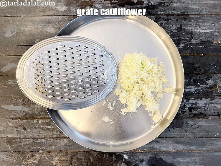 Step 54 – Grate the cauliflower by holding the whole cauliflower with the stem against the thickest holes …