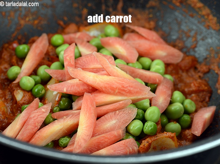 Step 29 – Add &frac12; cup <a href="https://www.tarladalal.com/glossary-diagonally-cut-carrot-2315i">diagonally cut carrot</a>.