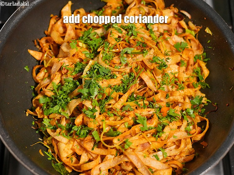 Step 31 – Add 2 tbsp <a href="https://www.tarladalal.com/glossary-chopped-coriander-783i">chopped coriander (dhania)</a>.