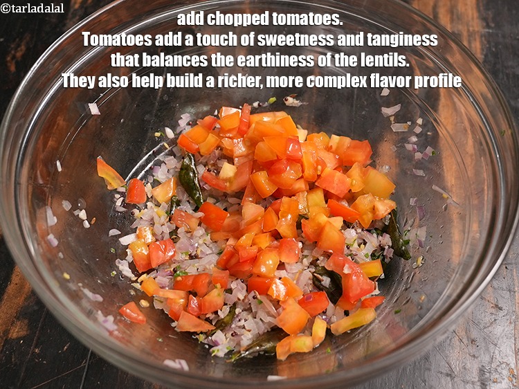 Step 28 – Add &frac12; cup <a href="https://www.tarladalal.com/glossary-chopped-tomatoes-779i">chopped tomatoes</a>. Tomatoes add a touch of sweetness and tanginess that …