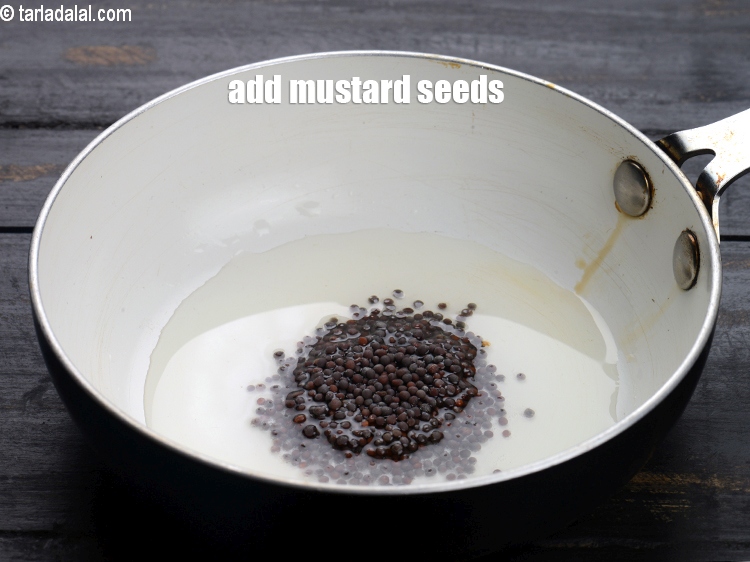 Step 29 – Add 1 tsp <a href="https://www.tarladalal.com/glossary-mustard-seeds-sarson-rai-sarson-ke-beej-525i">mustard seeds ( rai / sarson)</a>.