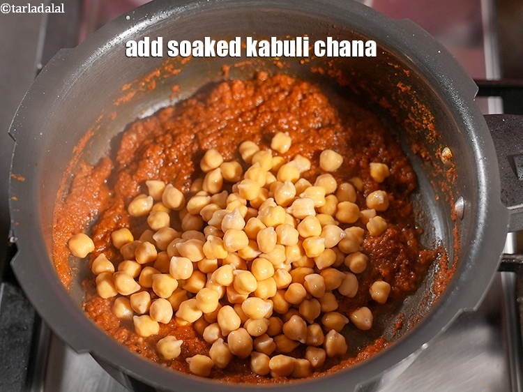 Step 27 – Add &frac34; cup <a href="https://www.tarladalal.com/glossary-soaked-kabuli-chana-291i">soaked kabuli chana (white chick peas)</a>.&nbsp;