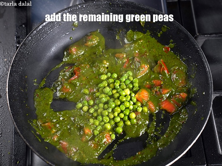 Step 28 – Add the remaining &frac14; cup <a href="https://www.tarladalal.com/glossary-green-peas-matar-hare-matar-vatana-180i">green peas</a>.