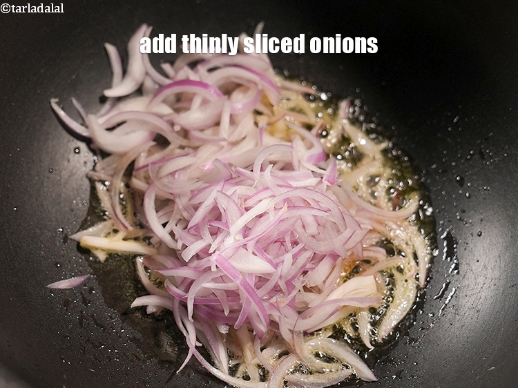 Step 29 – Add &frac12; cup thinly <a href="https://www.tarladalal.com/glossary-sliced-onions-745i">sliced onions</a>.