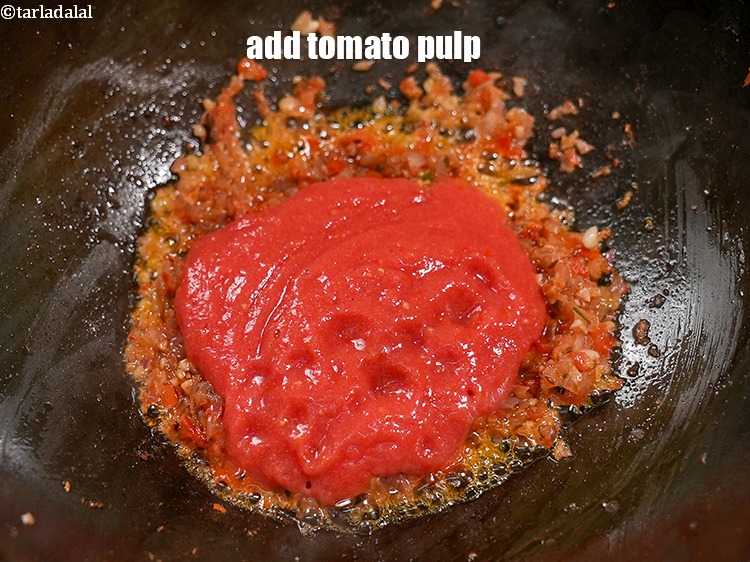 Step 29 – <p>Add ½ cup <a href="https://www.tarladalal.com/glossary-tomato-pulp-tamatar-ka-pulp-1039i">tomato pulp</a>.</p>