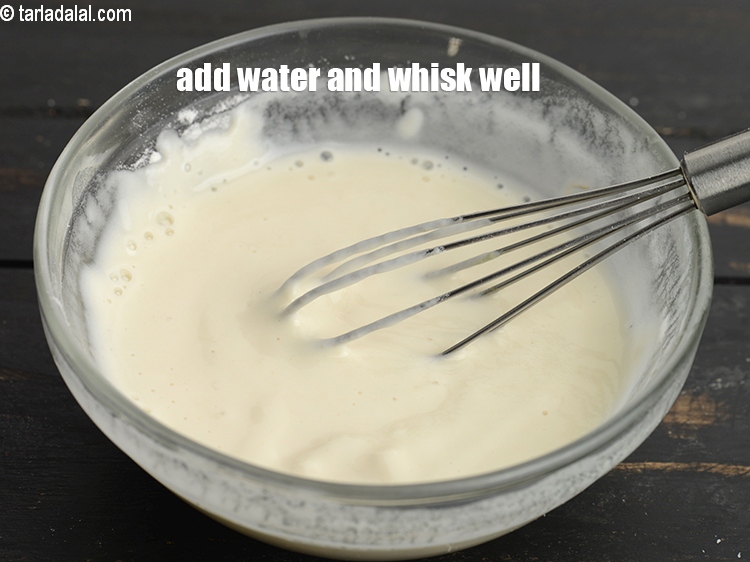 Step 29 – Add approx. 4 tbsp of water.&nbsp;Whisk well to make a thick paste. Keep aside.
