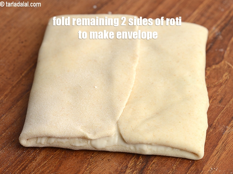 Step 30 – Fold the remaining 2 sides of the roti to make an envelope.&nbsp;