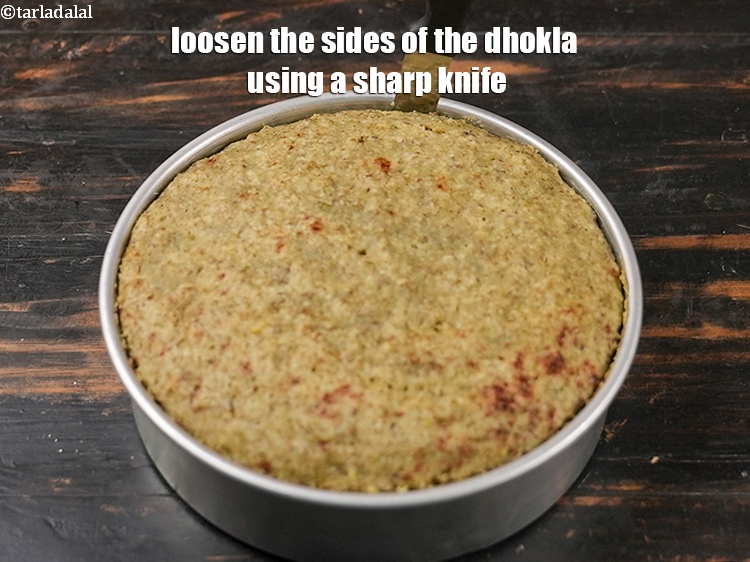Step 36 – Loosen the sides of the dhokla using a sharp knife.