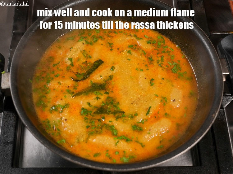 Step 28 – Mix well and cook on a medium flame for 15 minutes till the rassa thickens, …
