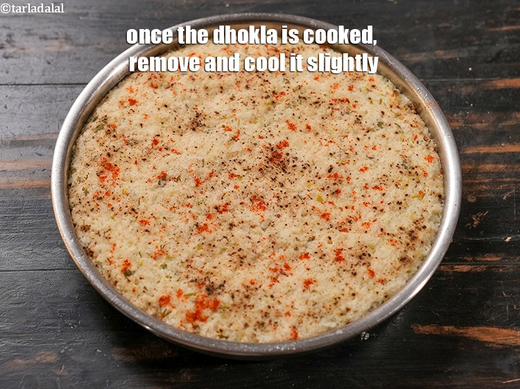 Step 28 – Once the dhokla is cooked, remove and cool it slightly.