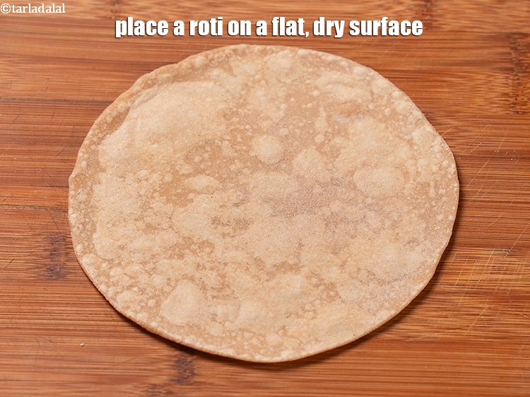 Step 30 – Place a roti on a flat, dry surface.