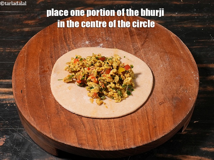 Step 36 – Place one portion of the bhurji in the centre of the circle.