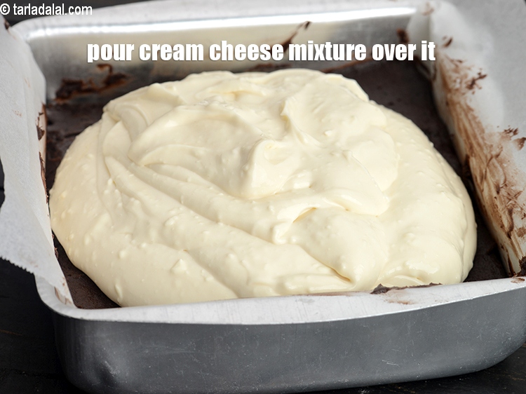 Step 29 – Pour this cream cheese mixture over the brownie mixture.