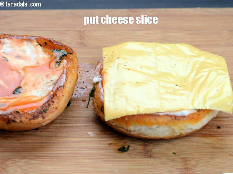 Step 28 – Put a cheese slice on the lower halve.