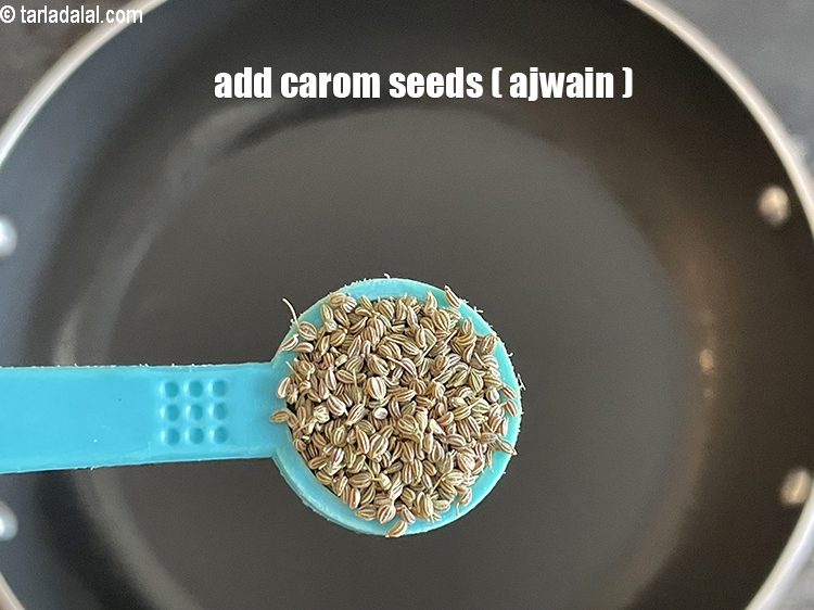 Step 31 – Add&nbsp;<meta charset="UTF-8" />1/2&nbsp;tsp&nbsp;<a href="glossary-carom-seeds-ajwain-thymol-seeds-bishops-weed-266i">carom seeds (ajwain)</a>.